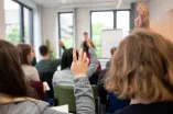 Meldungen aus dem Publikum während eines Vortrags