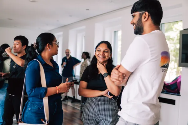 International Students at IHK Mittleres Ruhrgebiet in Bochum talking during the career fair "Your Future in NRW", organized by RUB and TU Dortmund.